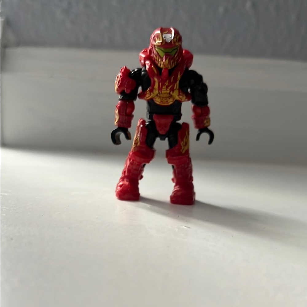 Red and Black Action Figure